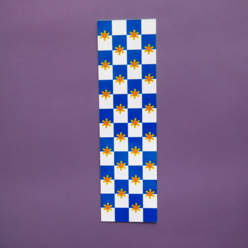 Blue and white checkered bookmark with yellow daisy flowers in each square, featuring a rectangular shape and a clean, modern aesthetic.