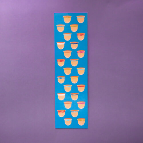 Blue bookmark featuring a structured grid pattern of traditional Arabic coffee cups (Dallah cups) in warm tones.