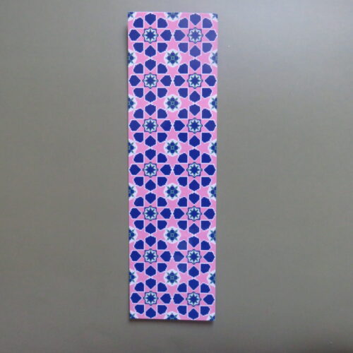 Rectangular bookmark featuring a dense, repeating geometric floral pattern in shades of soft pink and blue.